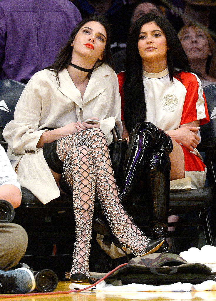 Kendall and Kylie sit together courtside at a Lakers game