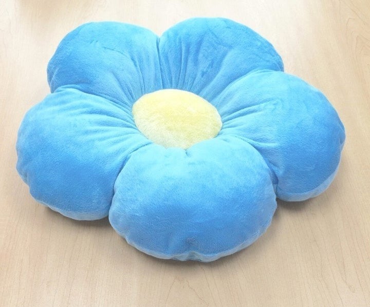 a large flower shaped floor pillow
