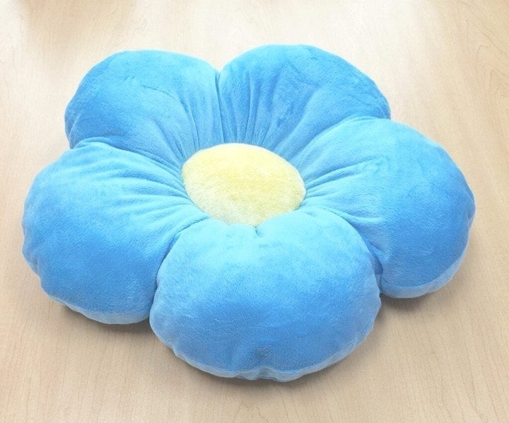 a large flower shaped floor pillow