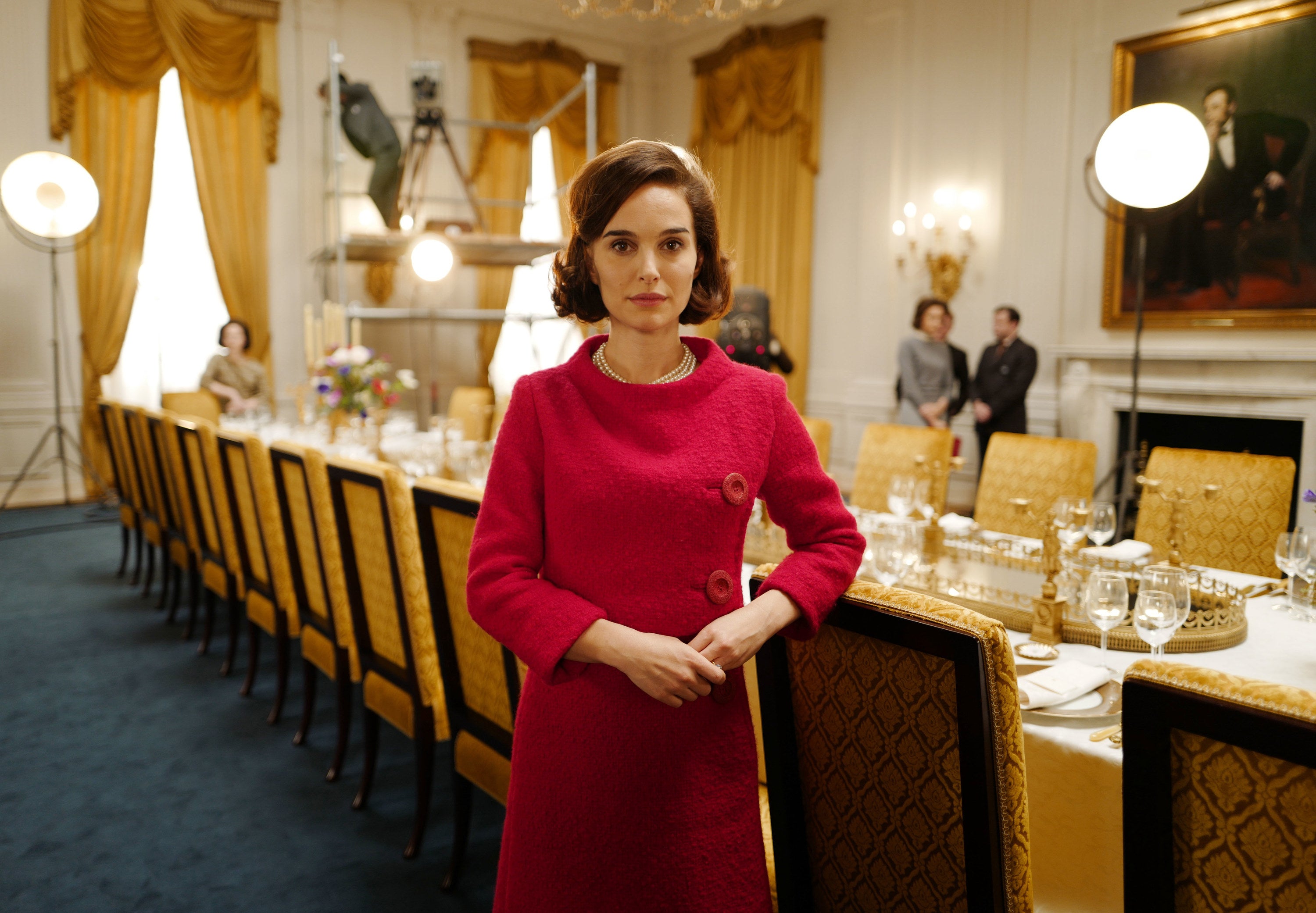 Natalie Portman stands by the White House dining room table