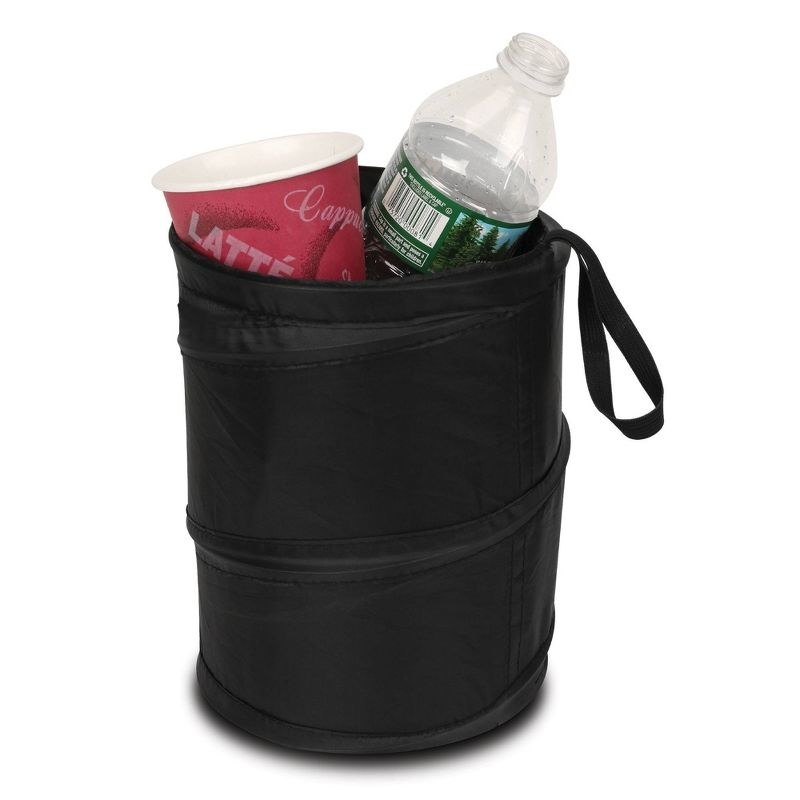 the black trash can with a cup and a water bottle
