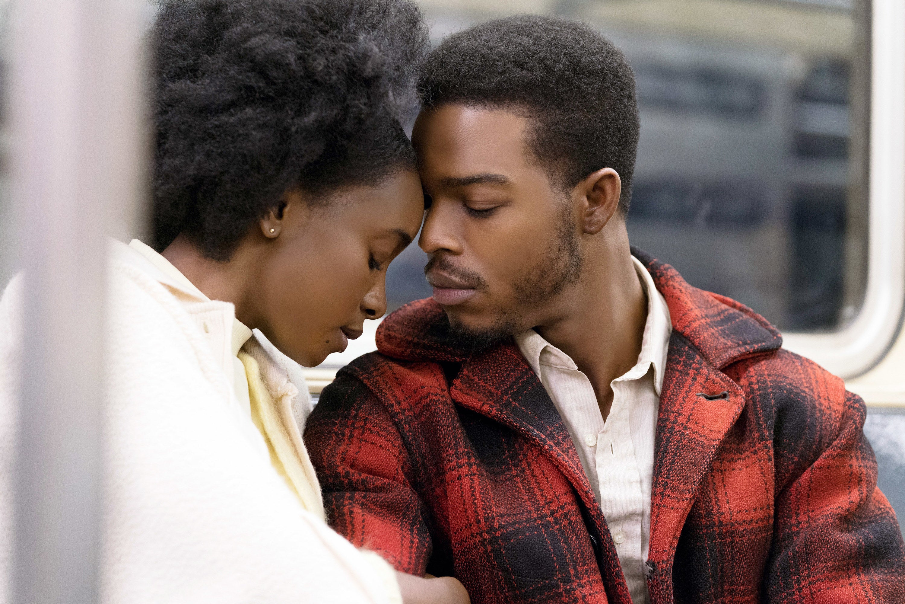KiKi Layne and Stephen James embrace on the subway