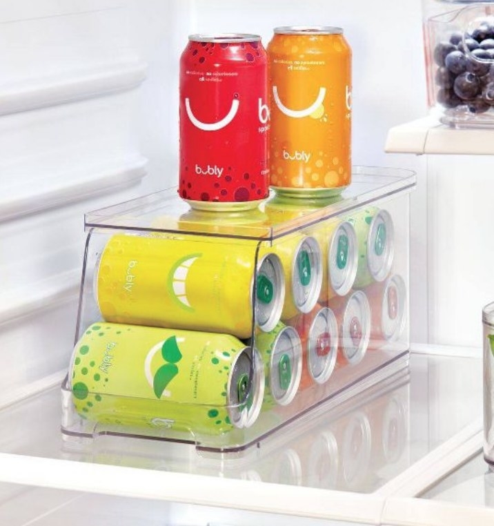 A soda can organizer in the fridge