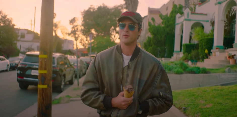 Jacob walking down the street and holding an ice cream cone as he&#x27;s interviewed by Vogue