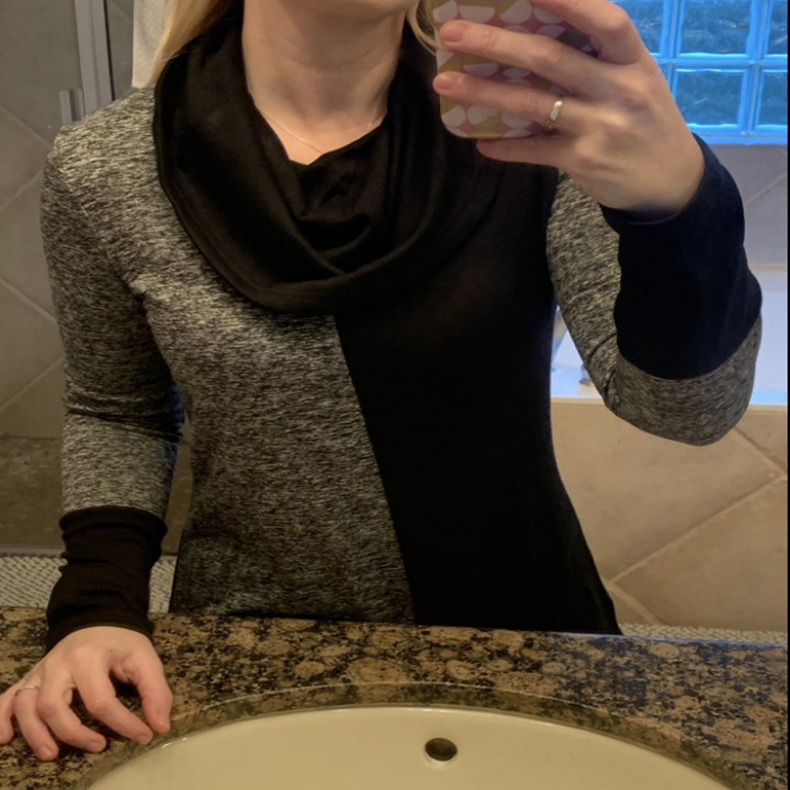 reviewer showing a closer view of the sweater