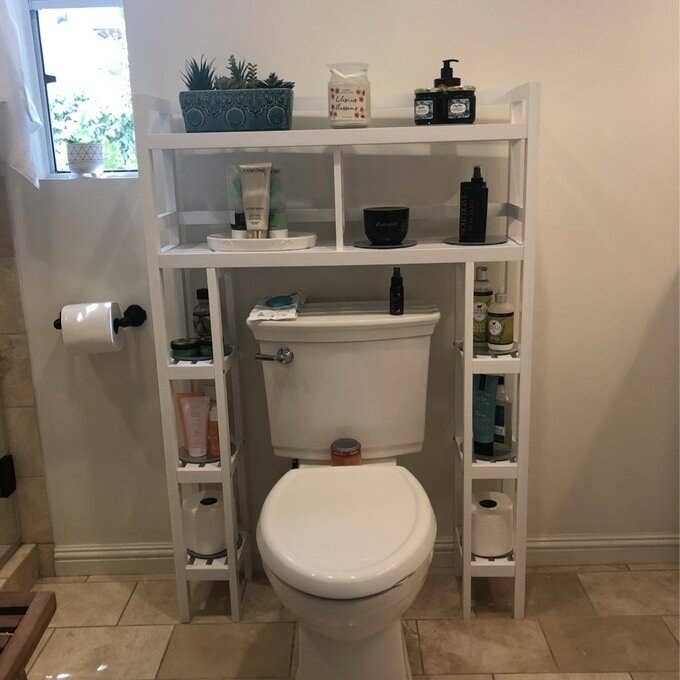 a reviewer photo of the over the toilet storage shelf in a bathroom
