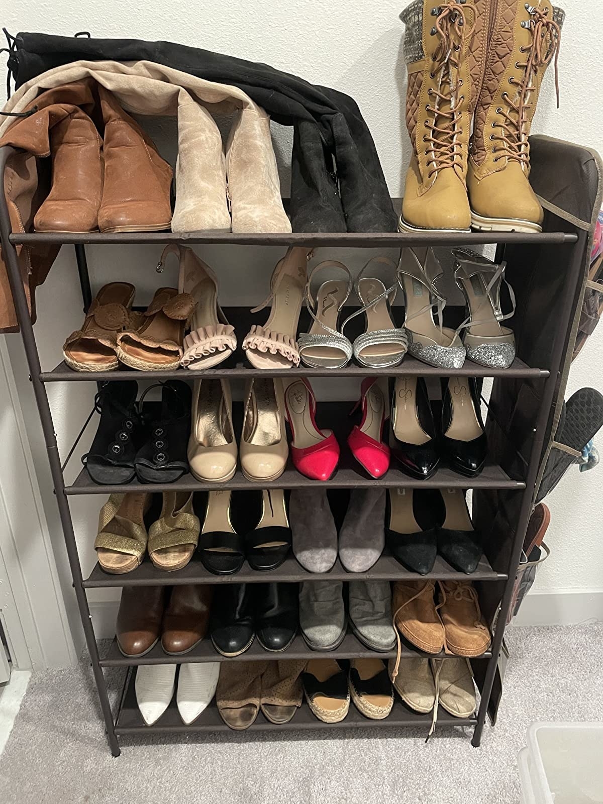 reviewer photo of a tiered shoe rack filled with shoes