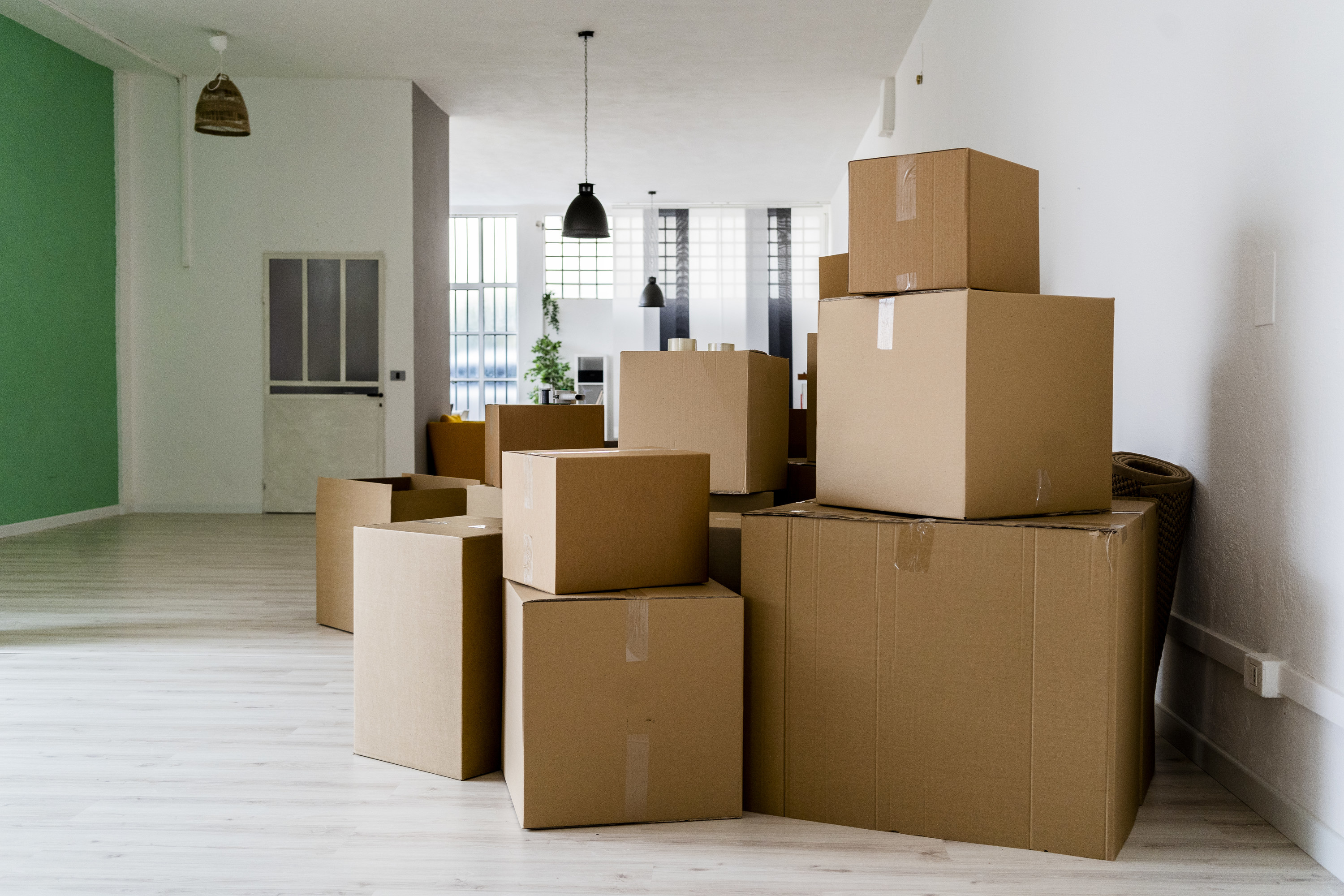 Moving boxes sitting on the floor in a house