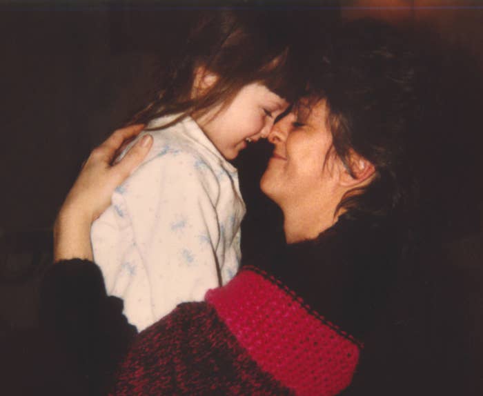 Vintage 1980s photograph of a mother and daughter hugging