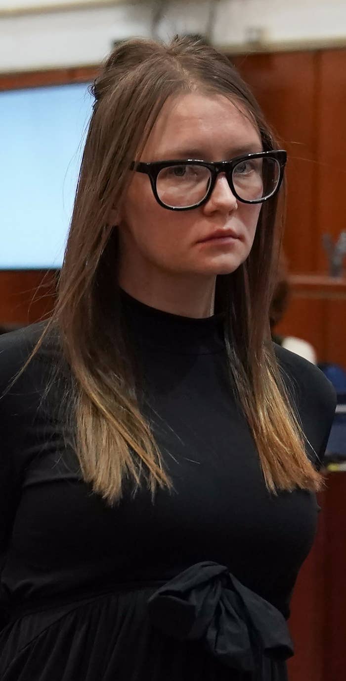 Sorokin in court, wearing a dark dress and glasses