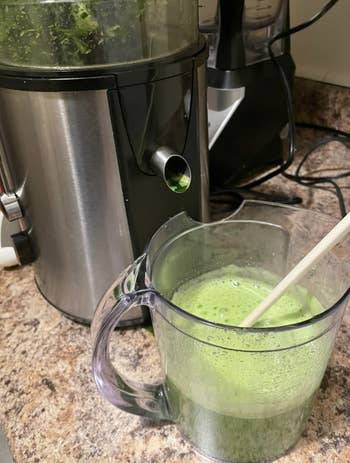 a reviewer's photo of their green juice from the juicer