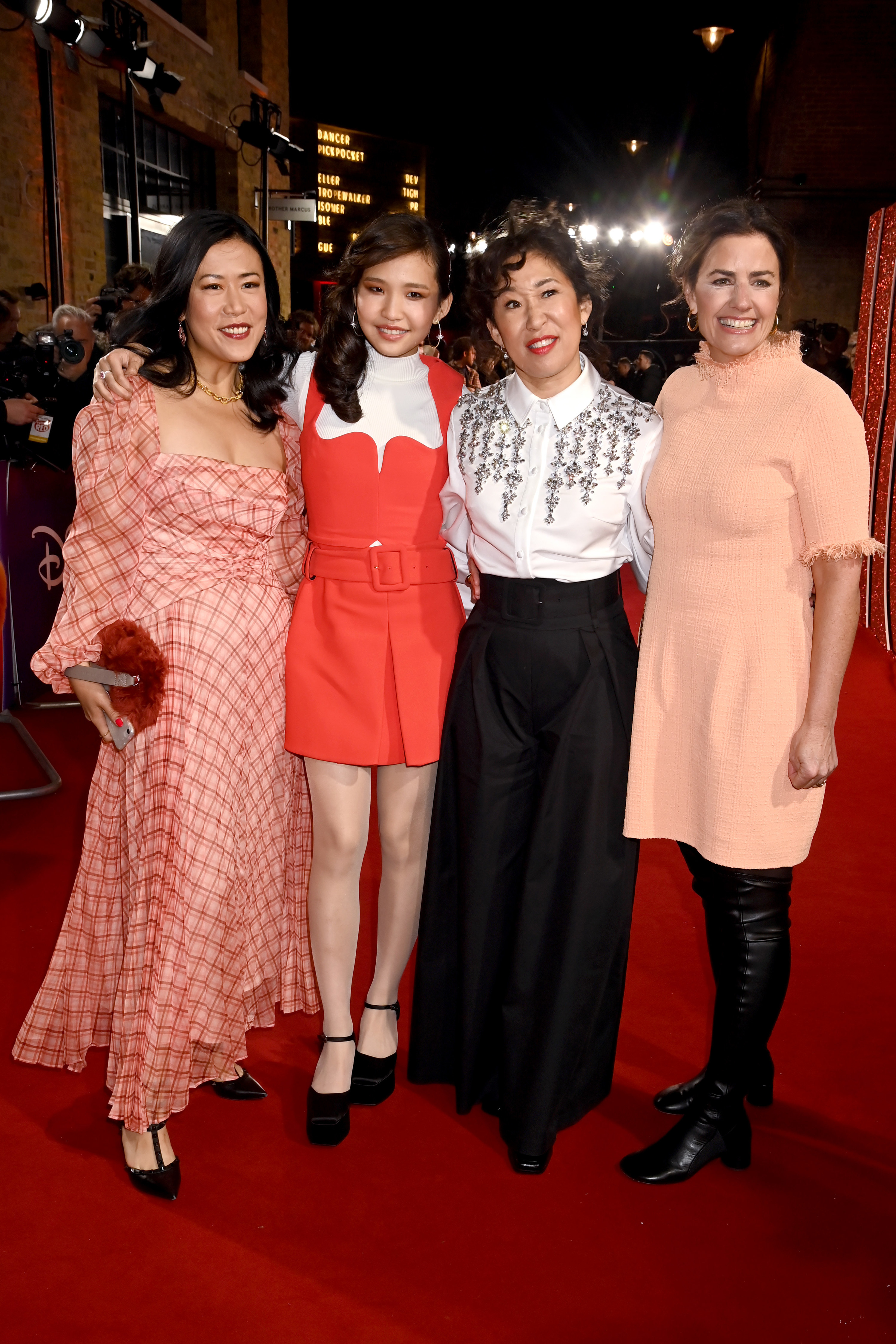 Domee Shi, Rosalie Chiang, Sandra Oh, and Lindsey Collins pose at the &quot;Turning Red&quot; premiere
