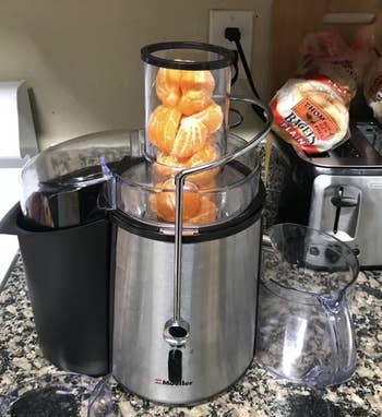 a reviewer's image of clementines in the juicer