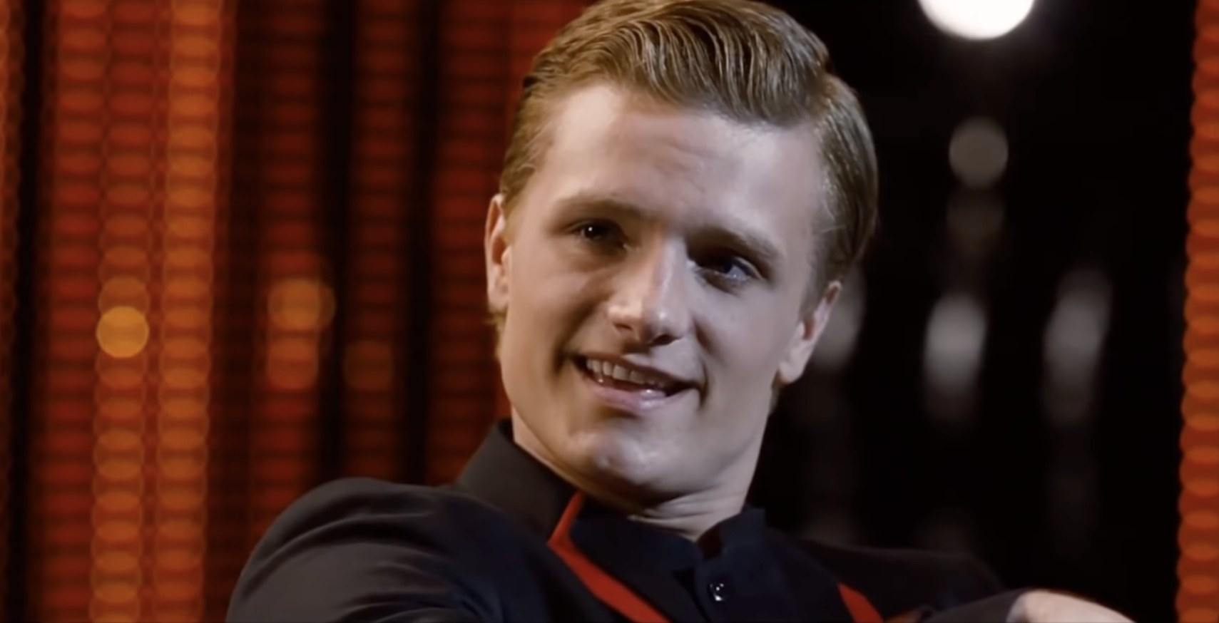 Peeta smiling in The Hunger Games