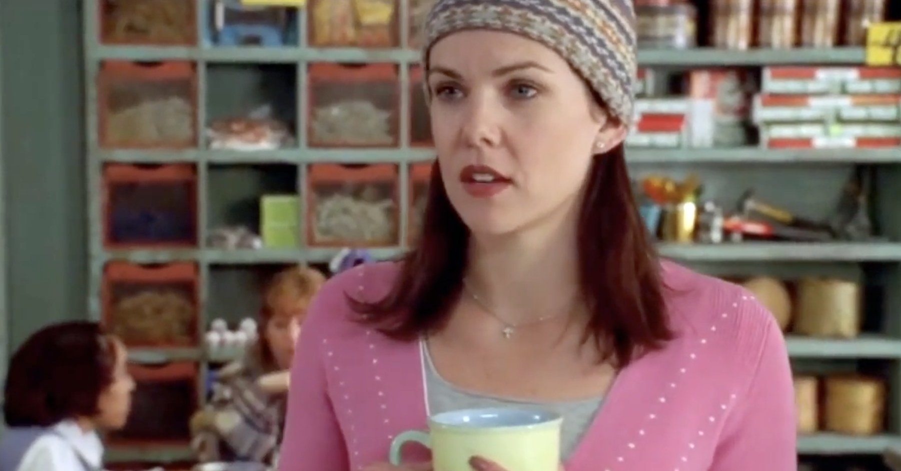 Lorelai holding a coffee mug in Gilmore Girls