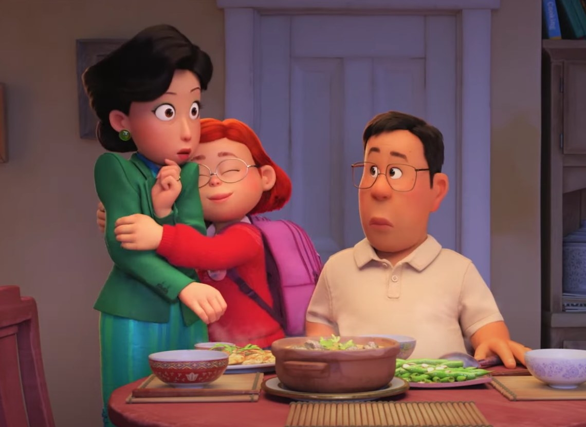 Mei hugs her mom as her dad sits at the dinner table