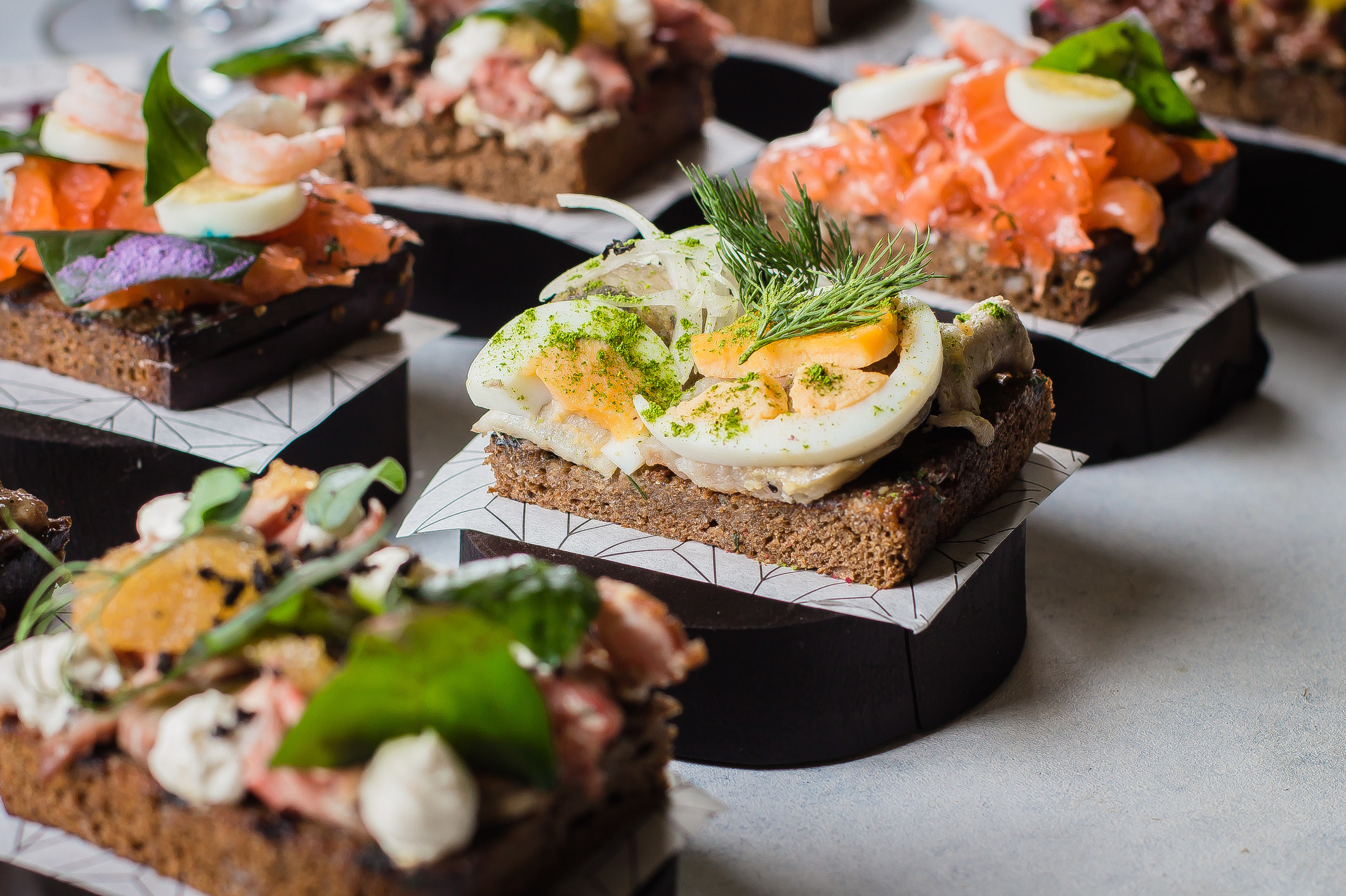 Open-faced sandwiches with different toppings