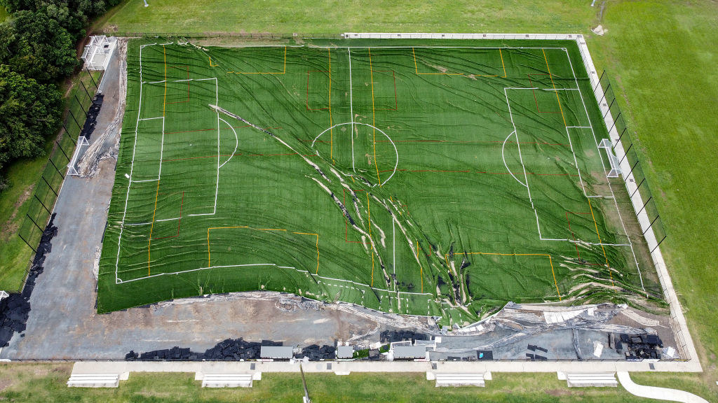 A football club&#x27;s field that was destroyed by floodwaters