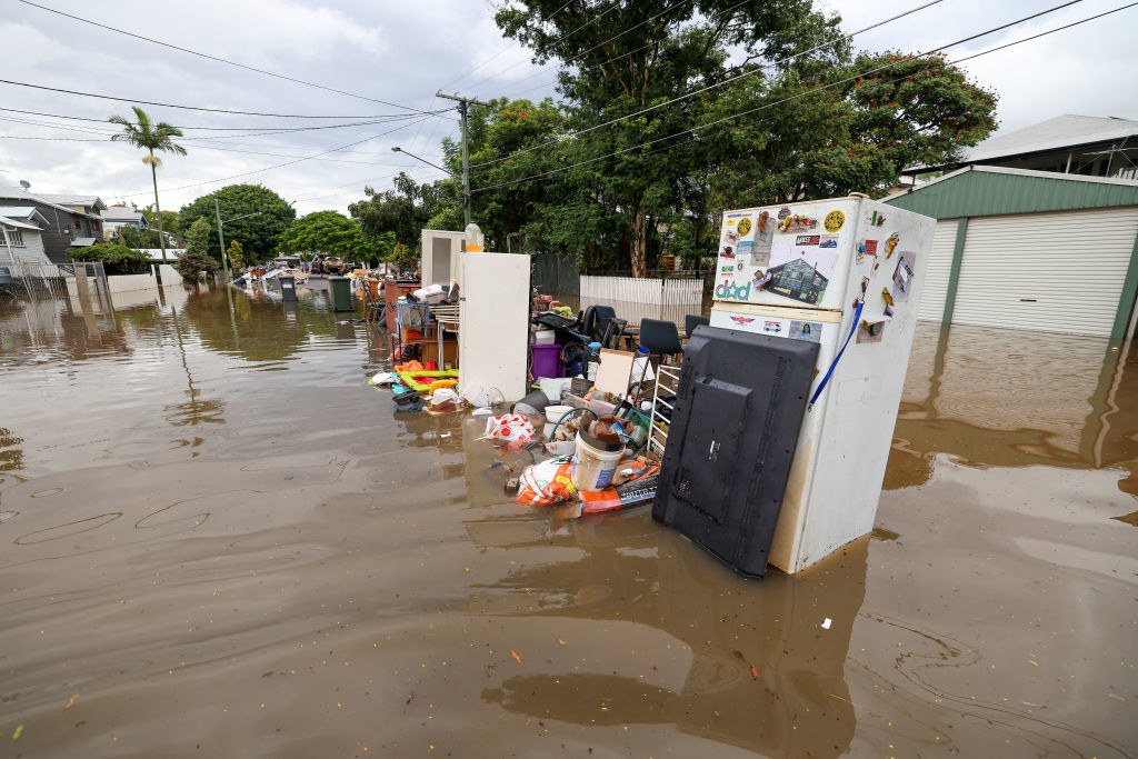 Rubbish piled up on a flooded road at Vincent Street in Brisbane, Australia.