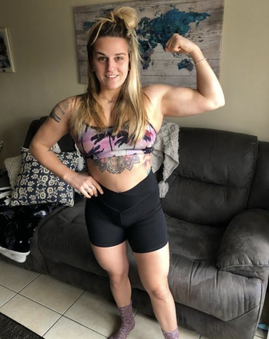 Reviewer&#x27;s photo wearing the black biker shorts with a sports bra