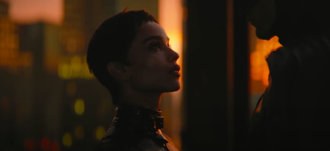 Selina staring up at Batman with the sun behind her in "The Batman"