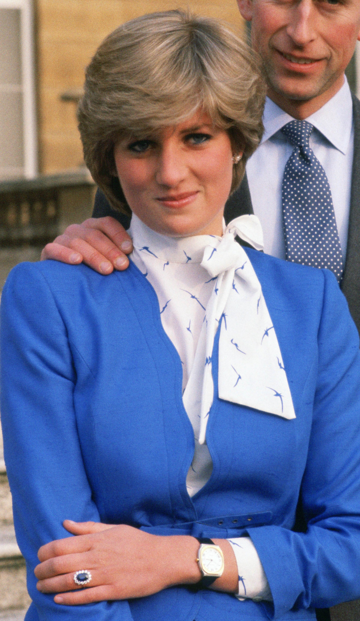 Princess Diana posing with her engagement ring and wearing a blue dress in 1981