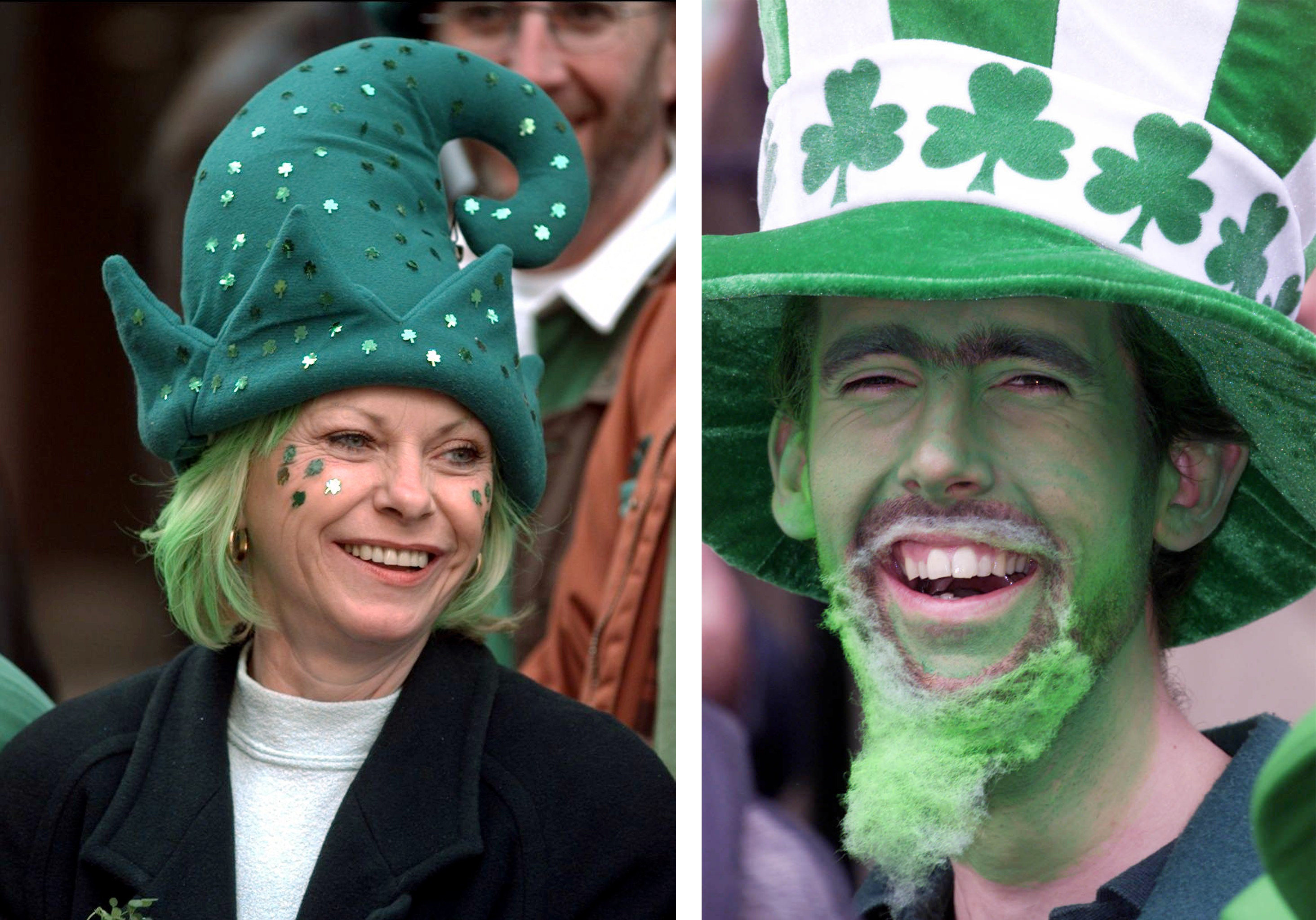 left, a woman with shamrock stickers on her face and green hair, right, a man with a fake green beard and a facepainted green face and a green hat 