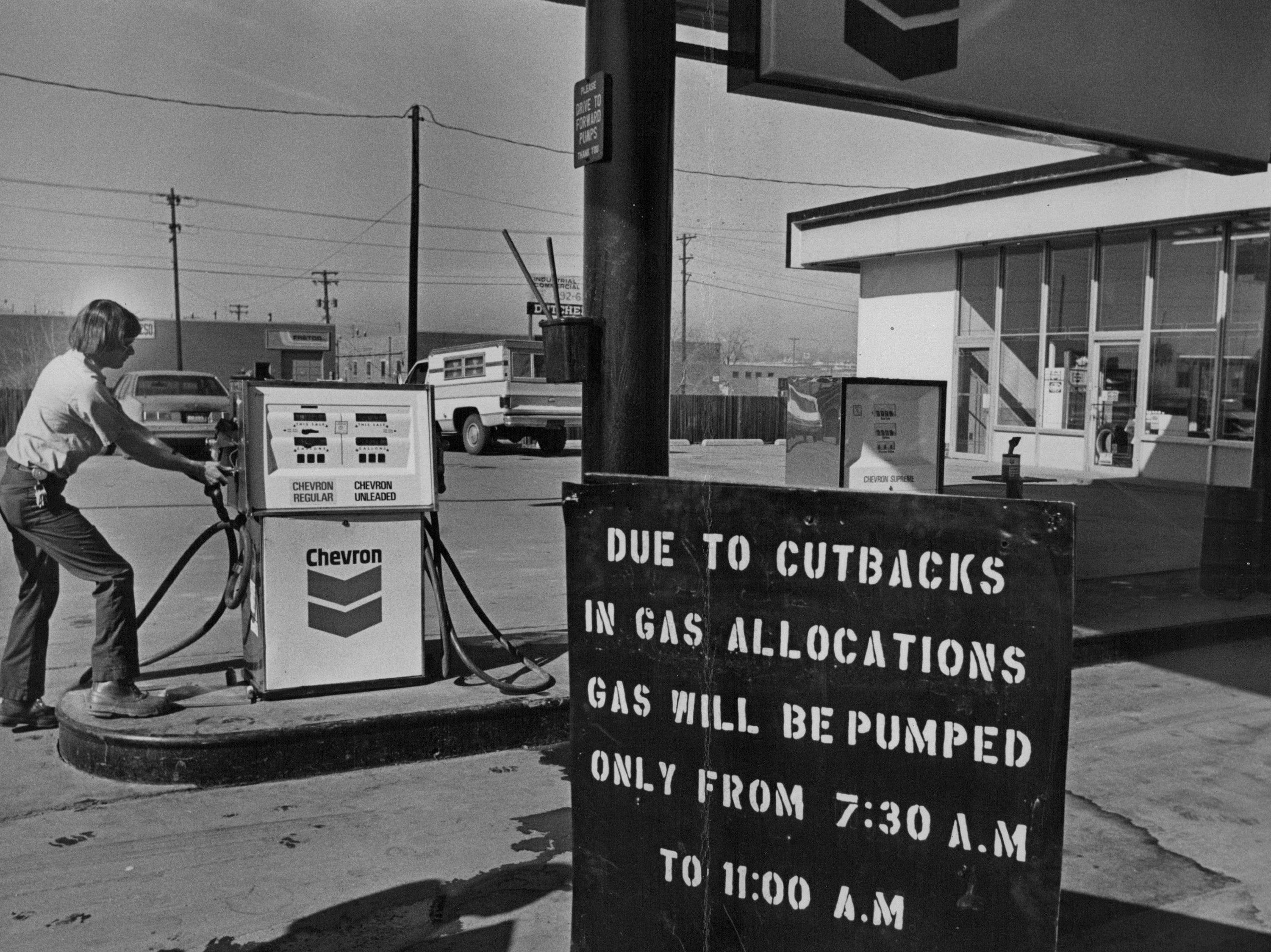 A sign at a Chevron station reads &quot;due to cutbacks in gas allocations, gas will be pumped only from 7:30am to 11am&quot;