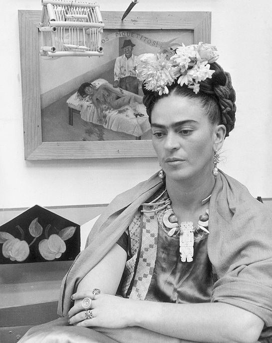 closeup of Frida with a unibrow and hair in braids