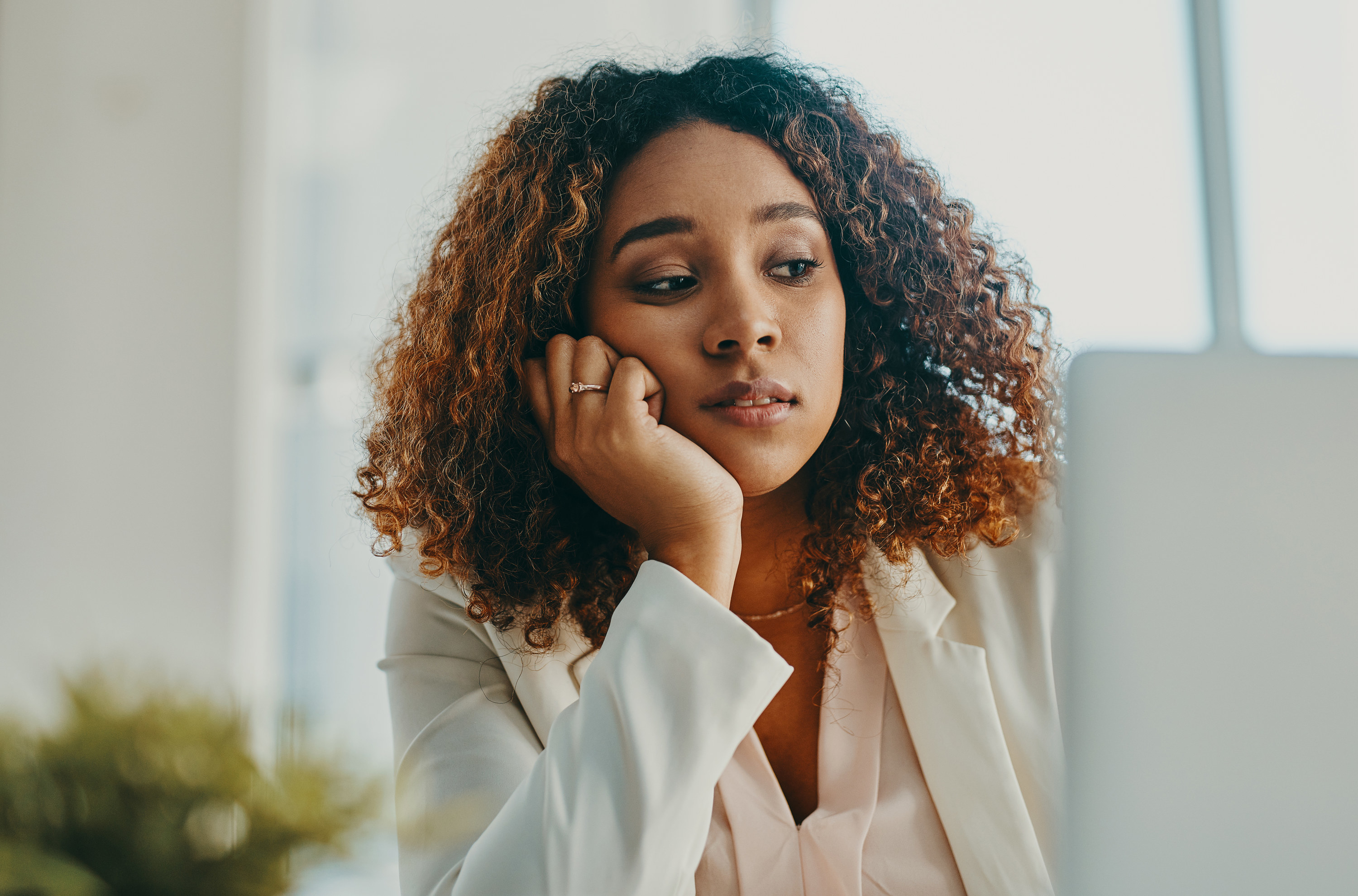 A woman bored at her desk