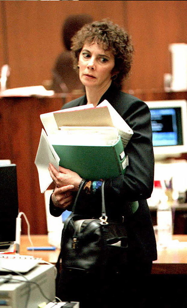 marcia with short curly hair in court