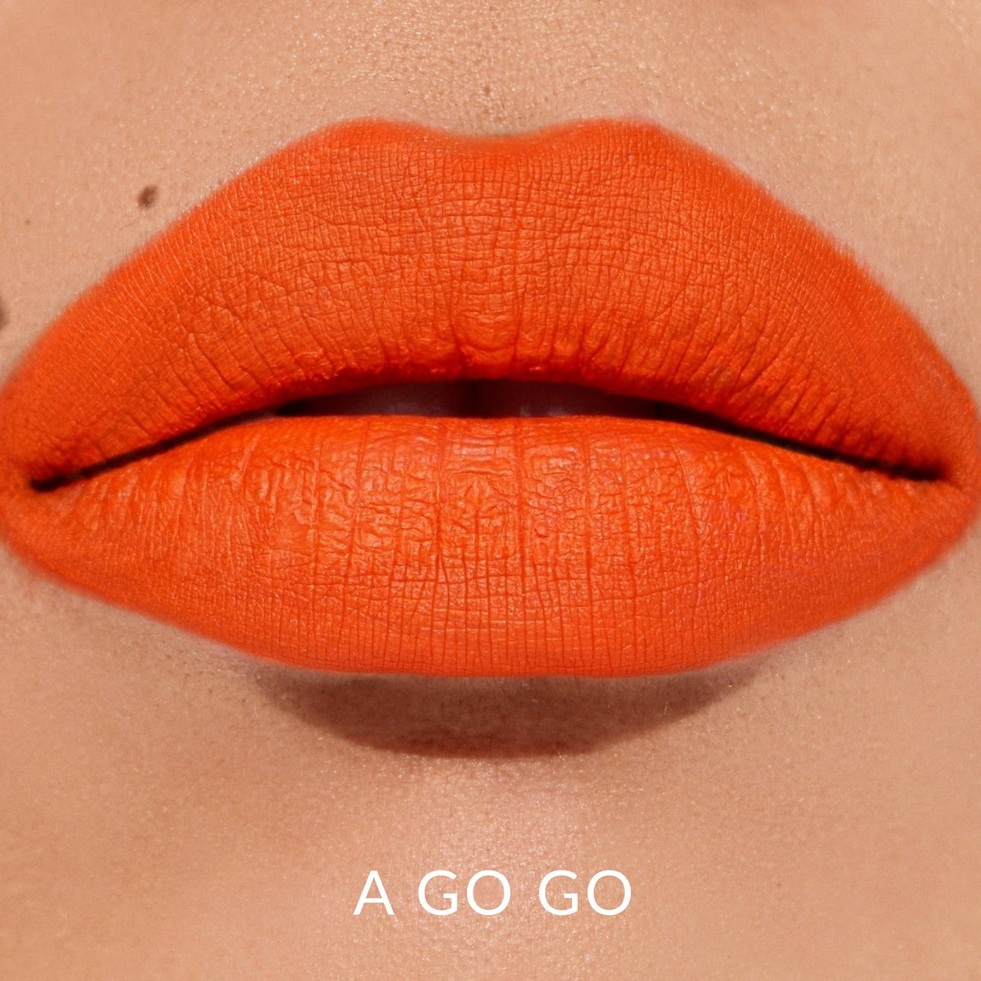 orange lipstick on model