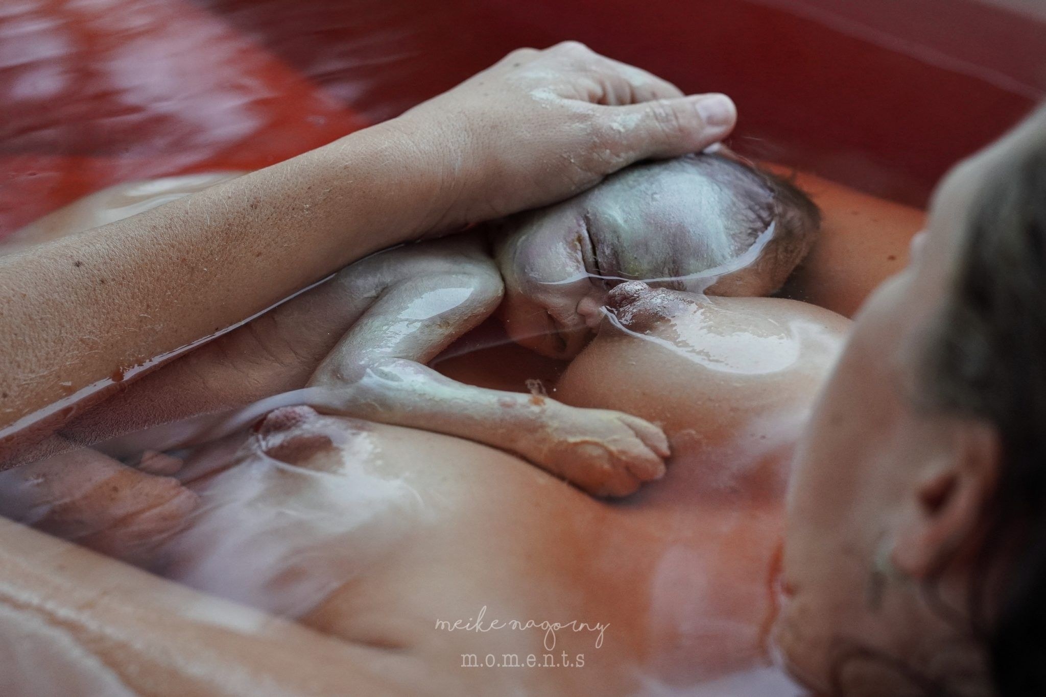 A mother holds her stillborn baby