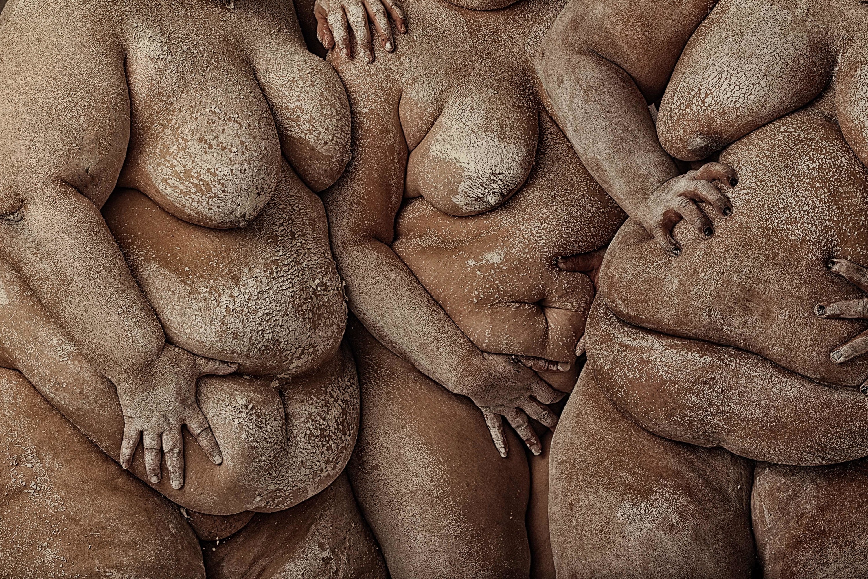 Three naked women&#x27;s torsos