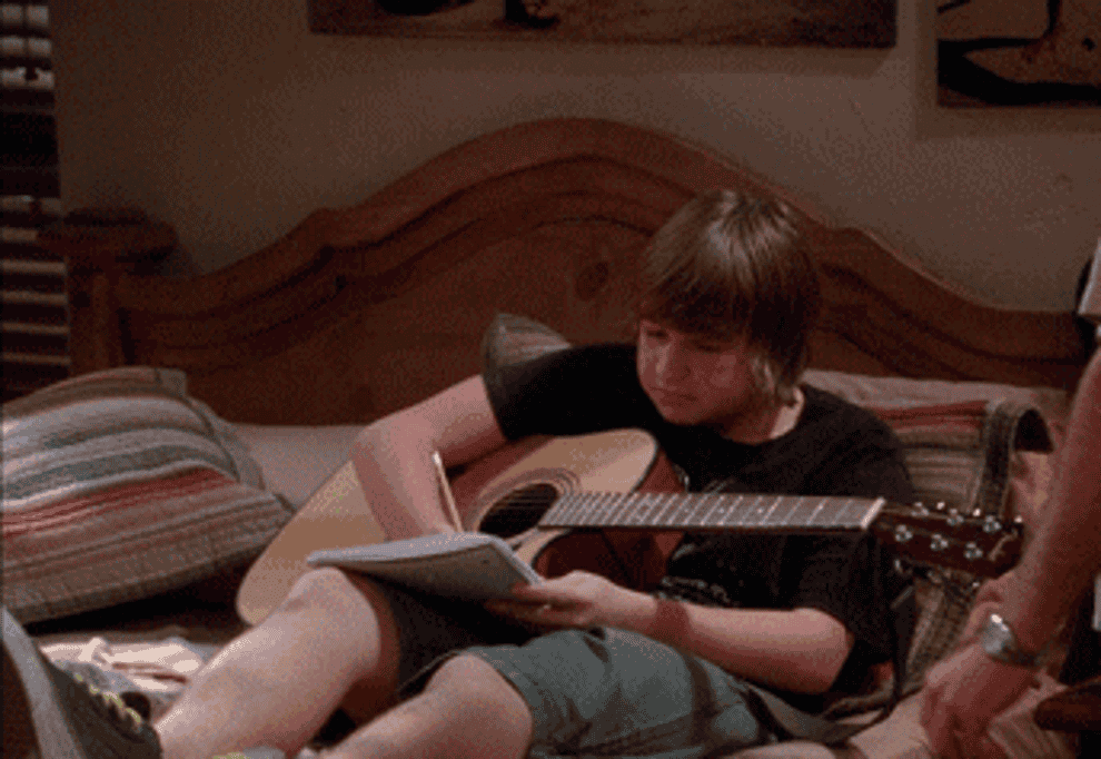 Angus T. Jones holding a guitar in &quot;Two and a Half Men&quot;