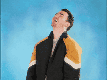 Kevin Jonas laughing before becoming immediately serious