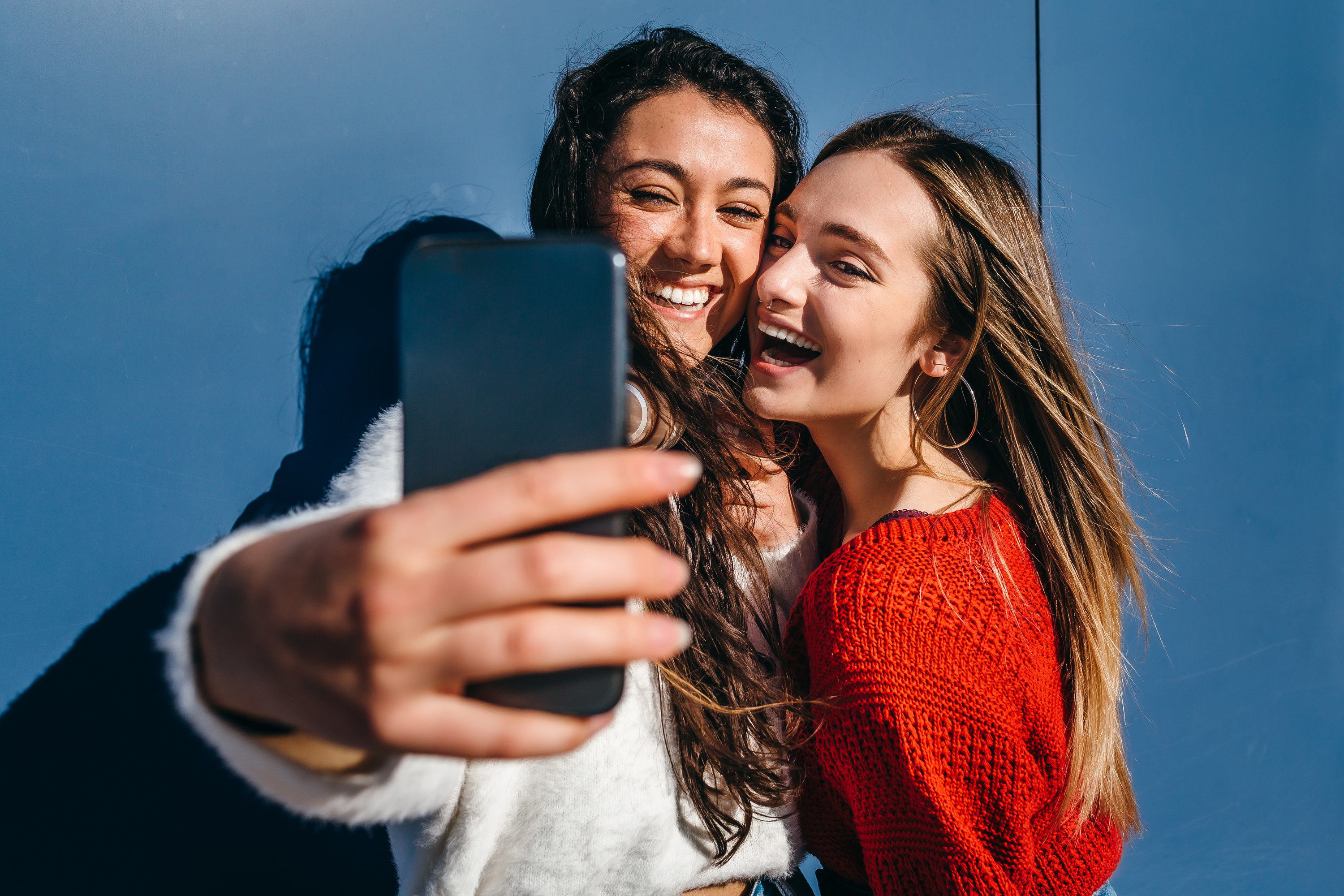Two female friends taking a selfie together