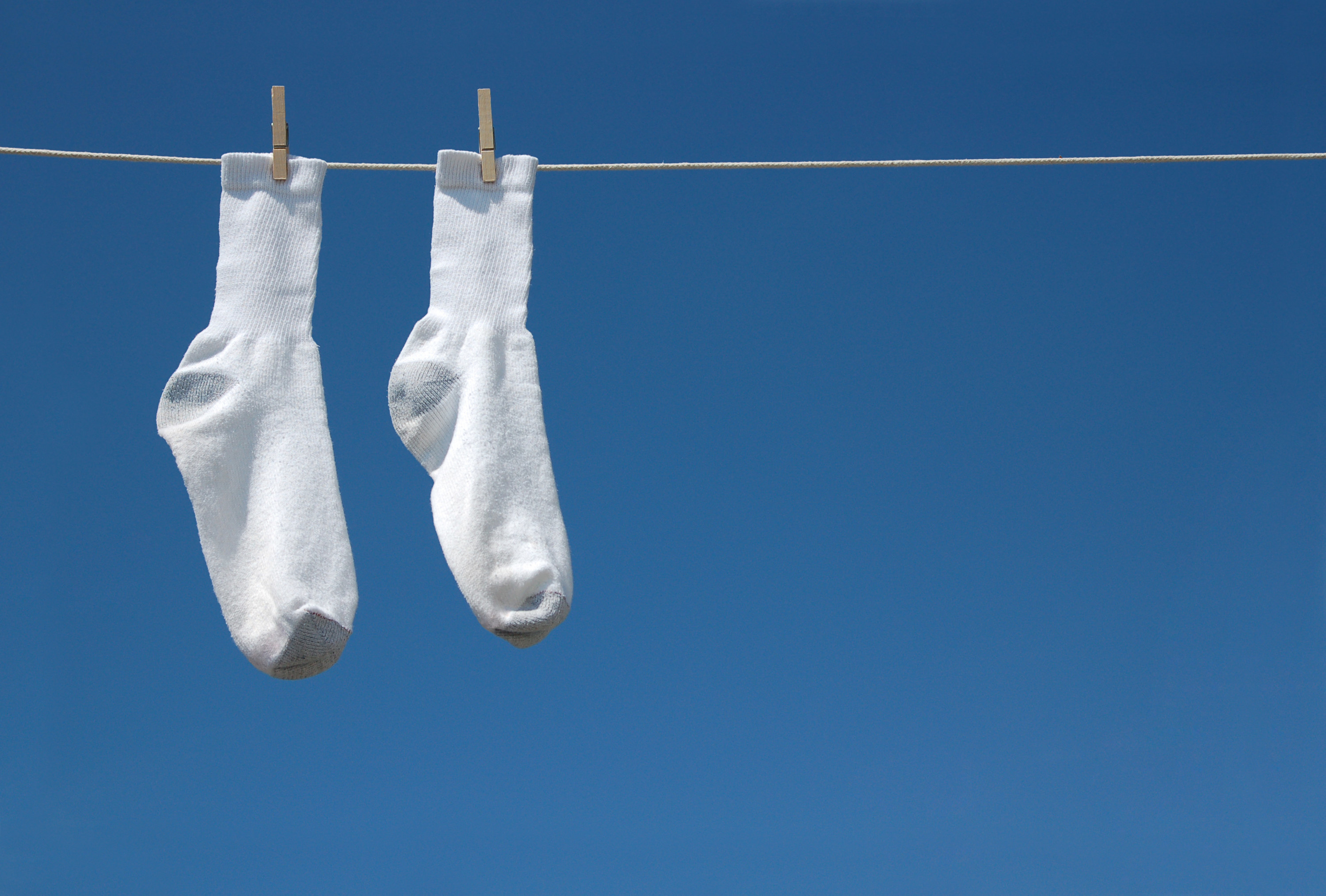pair of socks hanging from a clothes hanger