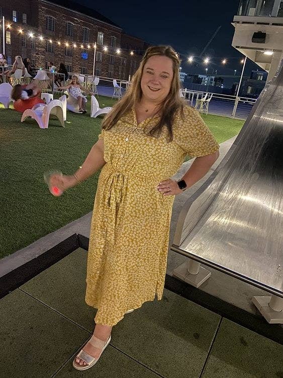 reviewer wearing the dress in yellow