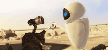 Wall-E and Eve holding hands and laughing