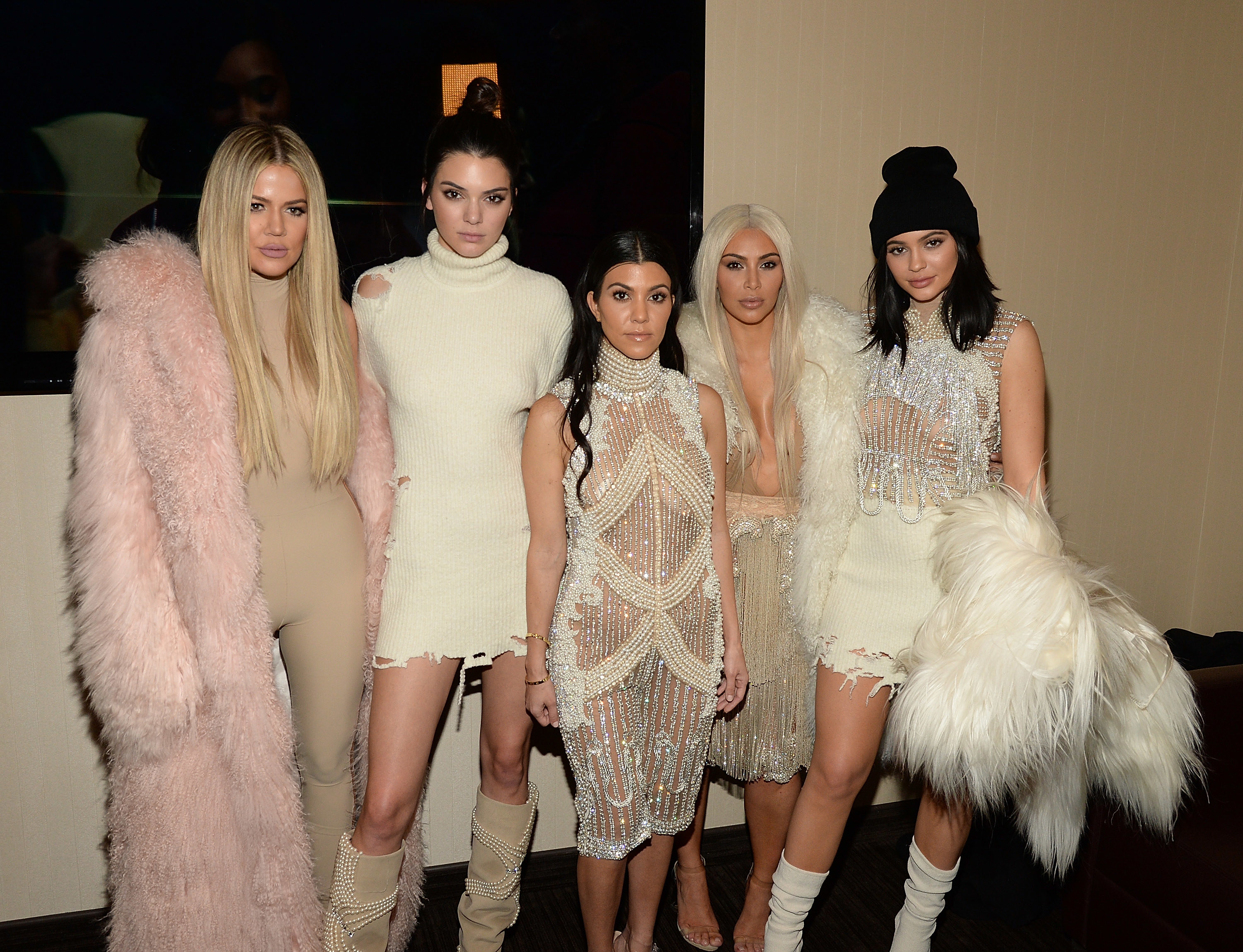 Khloé, Kendall, Kourtney, Kim, and Kylie stand together