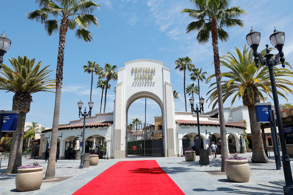 The entrance to Universal Studios is seen during Universal Studios Hollywood grand reopening with a red carpet and palm trees lining the front arch