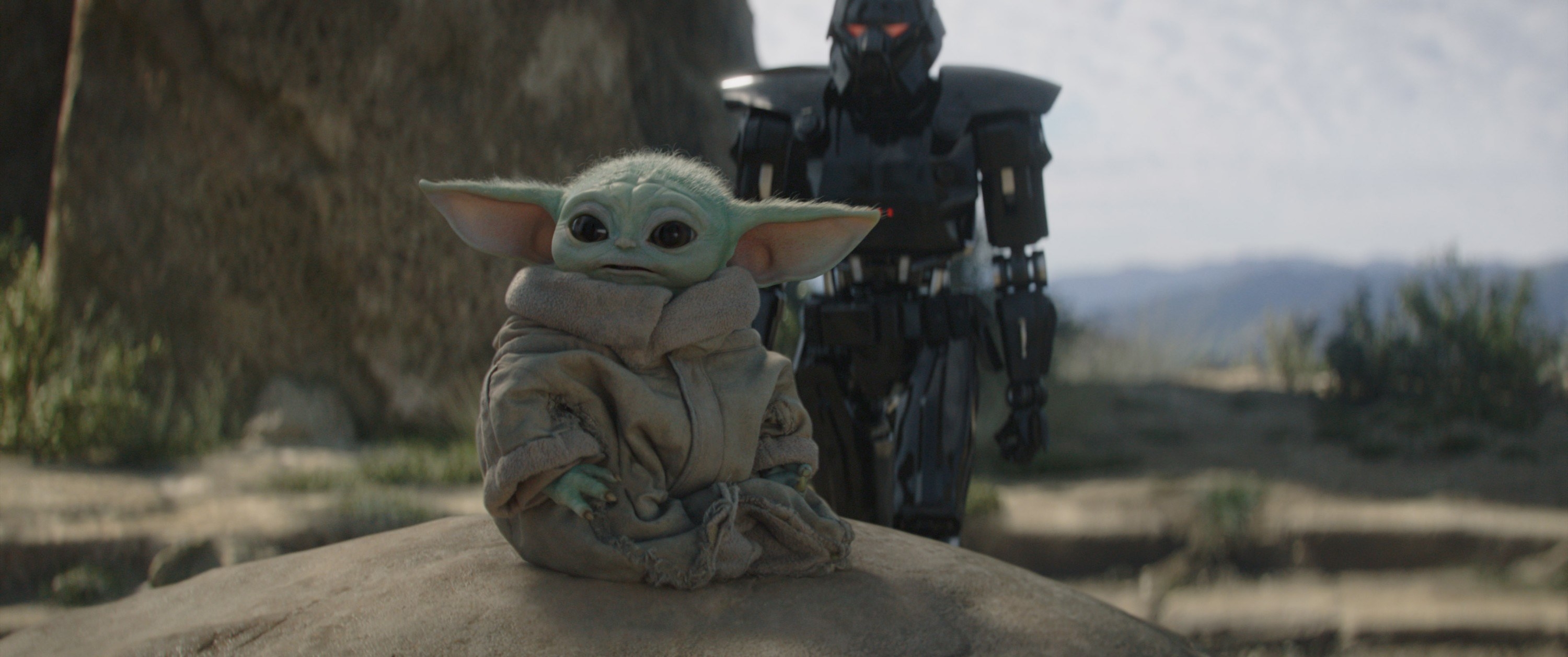 Baby Yoda looking off into the distance