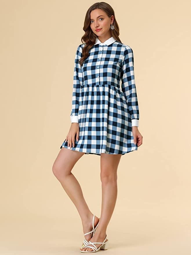 model wearing the checkered dress in blue