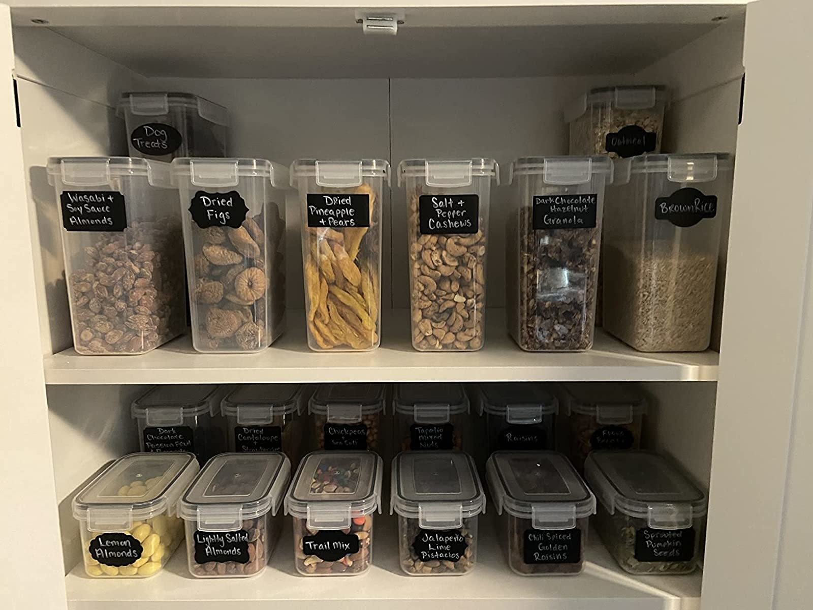 The reviewer shows the containers in use in the pantry