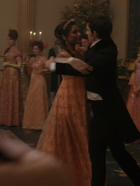 Kate dances with a man in her dress paired with long gloves