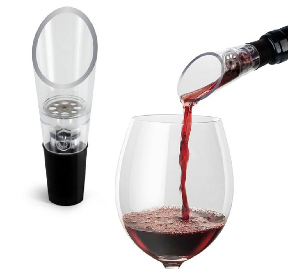 A model pouring red wine into a glass using an aerating spout