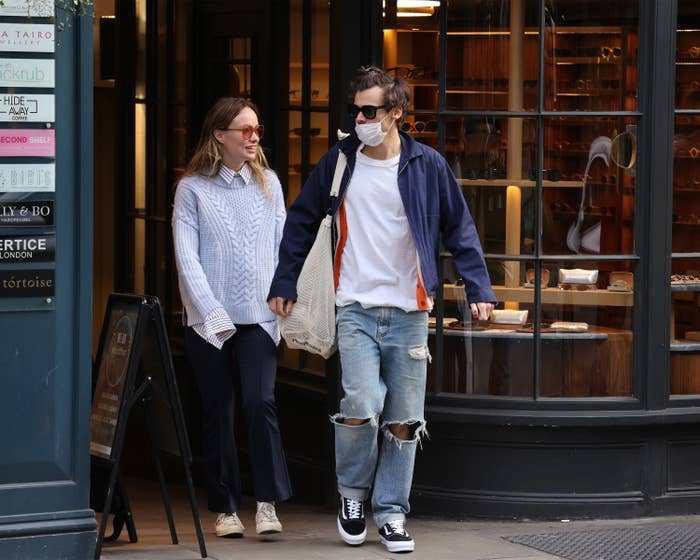 Harry and Olivia walking out of a store together