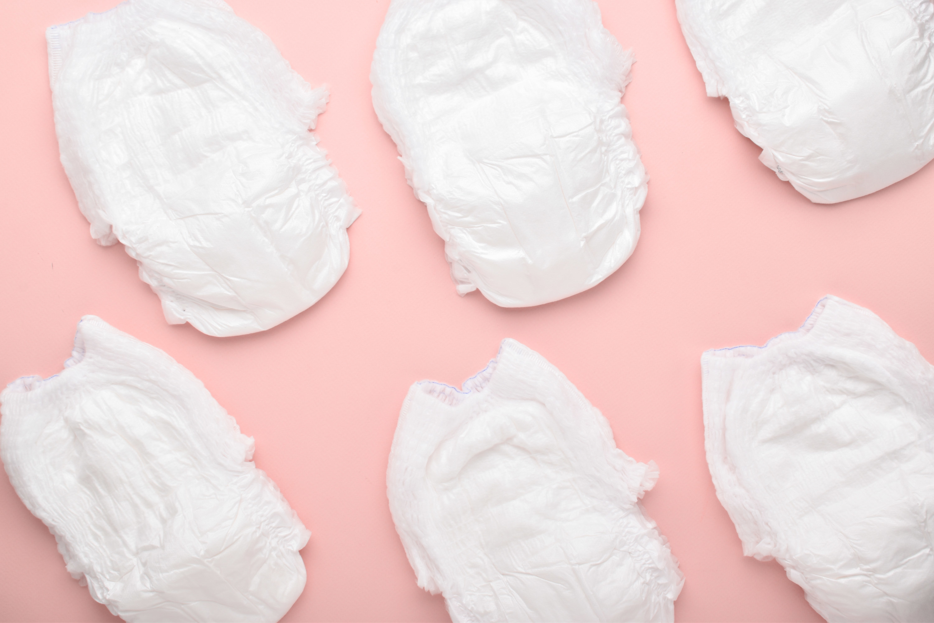 Background of diapers on a pink background