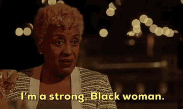 A woman holding a drink and saying, &quot;I&#x27;m a strong, Black woman.&quot;